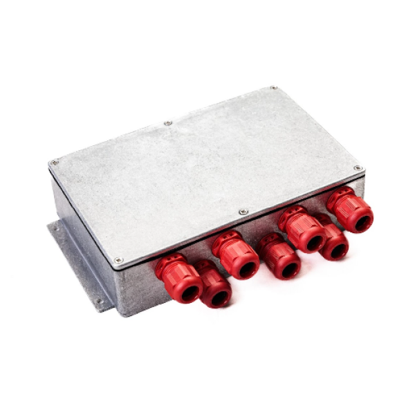 a close up of a metal box with red connectors on it